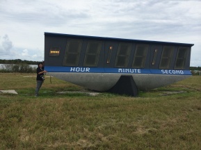 I am so small compared to the countdown clock. This is being retired and replaced with a new clock with LED lights.